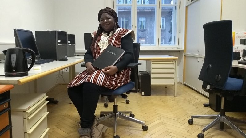 Bernadette Yougbaré in her office at BOKU with PhD thesis