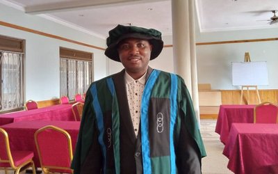 Thaddeo in Phd graduation gown