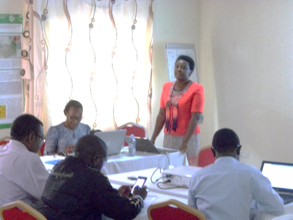 A woman presenting in front of an audience